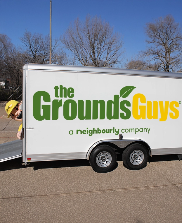 The Grounds Guys branded trailer.