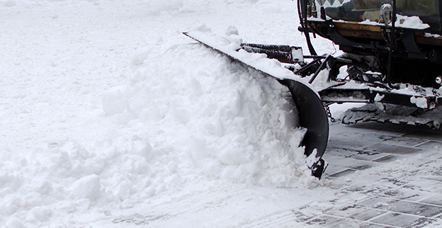 Snow plow plowing snow.