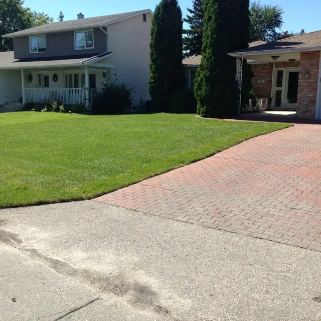 manicured lawn in front of a house